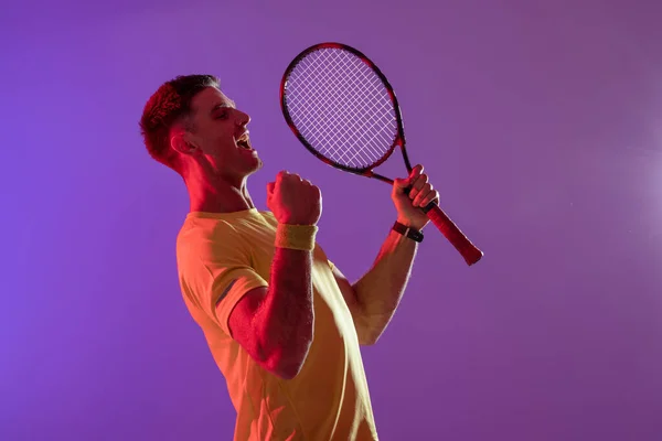 Happy Caucasian Male Tennis Player Tennis Racket Neon Pink Lighting — Stok fotoğraf
