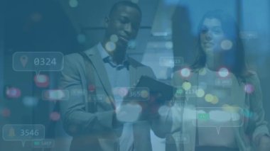 Animation of media icons over diverse business people in office. Global business and digital interface concept digitally generated video.