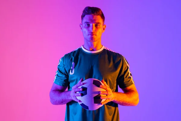 Portrait Caucasian Male Soccer Player Football Neon Pink Lighting Sport — Stockfoto