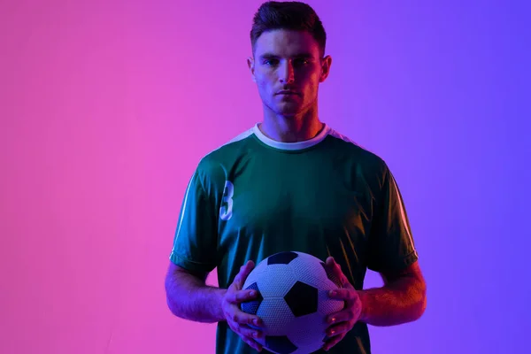 Portrait Caucasian Male Soccer Player Football Neon Pink Lighting Sport — 图库照片