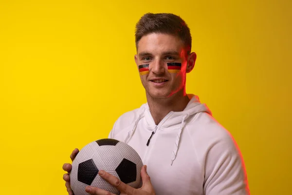 Portrait Happy Caucasian Male Football Supporter Flag Germany Yellow Lighting — Stock fotografie