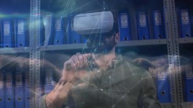 Animation of network of connections over caucasian man wearing vr headset. Network, connections, communication and technology concept digitally generated video.