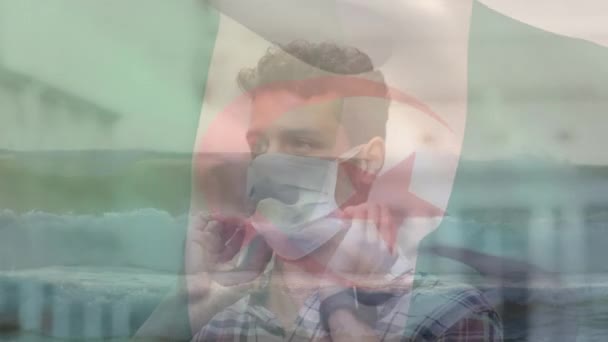 Animation Flag Algeria Biracial Man Face Mask Health Covid Pandemic — Stockvideo