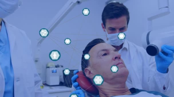 Network Digital Icons Caucasian Male Dentist Examining Male Patient Teeth — Stock Video