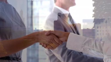 Animation of happy caucasian businesspeople shaking hands over cityscape. global business and communication concept digitally generated video.