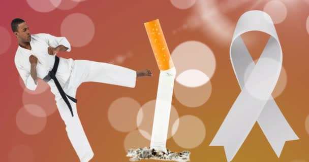 Animation White Ribbon African American Karate Man Kicking Cigarette Lung — Vídeos de Stock