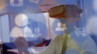 Animation of digital icons over caucasian businessman wearing vr headset. global data processing, connections, digital interface and data processing concept digitally generated video.