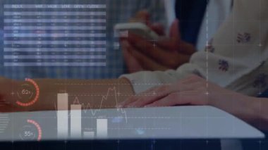 Animation of financial data and graphs over hands of caucasian woman making notes. Business, finance, web development, finance and technology concept digitally generated video.