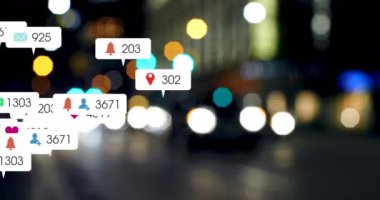 Animation of social media icons and numbers over out of focus city lights. global social media, networking, connections and digital interface concept digitally generated video.
