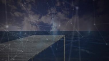 Rıhtımla deniz manzarası üzerinde bağlantılar ve grafiklerin animasyonu. Dijital olarak oluşturulan küresel ağ, finans, bağlantılar ve teknoloji konsepti.