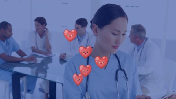 Animation Falling Hearts Icons Diverse Group Doctors Global Medicine Technology — Stok video