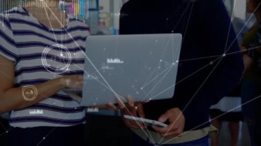 Animation of network of connections over diverse male and female office colleagues discussing. Global networking and business technology concept