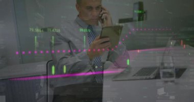 Animation of data processing over caucasian businessman using tablet and talking on smartphone. Global business, finances and digital interface concept digitally generated video.