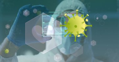 Animation of yellow virus cells over caucasian male lab worker with digital card with virus data. Science, medicine and covid 19 pandemic concept digitally generated video.