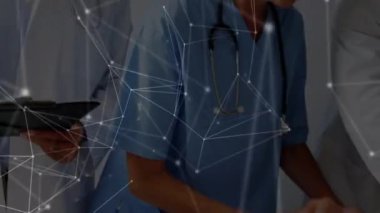 Animation of network of connections over diverse doctors with patient. Health, medicine, connections and technology concept digitally generated video.