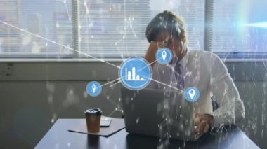 Animation of network of connections over caucasian man using laptop in office. Network, connections, business and technology concept digitally generated video.