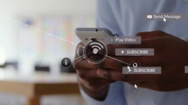 Ofiste akıllı telefon kullanan Afro-Amerikan iş adamının medya simgelerinin canlandırılması. Küresel iş ve dijital arayüz kavramı dijital olarak oluşturulmuş video.