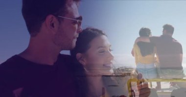Animation of dots over happy caucasian couple on beach. Holidays, vacations and relax concept digitally generated video.