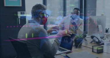 Animation of financial data processing over business people wearing face masks. Global medicine, healthcare services during covid 19 pandemic concept digitally generated video.