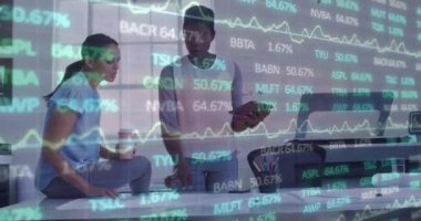 Animation of financial data and graphs over diverse female coworkers in office. Business, finance, economy, cooperation and communication concept digitally generated video.