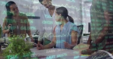Animation of financial data and graphs over diverse female coworkers in office. Business, finance, economy, cooperation and communication concept digitally generated video.