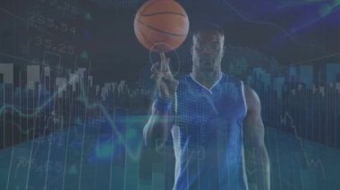 Animation of graphs and numbers over african american man with basketball. Sport, training, connections and technology concept digitally generated video,