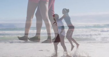 Animation of happy african american couple having fun on beach. Holidays, vacations, love, relationship and relax concept digitally generated video.