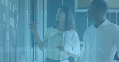 Animation of financial data processing and wind turbine over diverse business people. Global business, computing and digital interface concept digitally generated video.