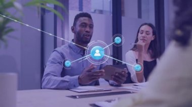 Animation of network of connections over diverse businesspeople in office. Business, connections, communication and technology concept digitally generated video.