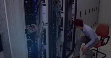 Covid-19 statistical data processing over caucasian female engineers working in computer server room. Covid-19 pandemic and business data storage technology concept