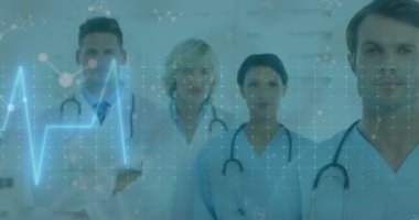 Animation of neon heart rate over caucasian female and male doctors. Health and medicine concept digitally generated video.