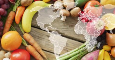 Masada yatan meyve ve sebze üzerindeki dünya haritasının animasyonu. Gıda, meyve, sebze ve dünya vegan günü konsepti dijital olarak üretilen video.