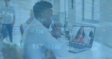 Animation of financial graphs and data over african american man having video call on laptop. Business, finance, economy, data processing and technology concept digitally generated video.