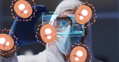 Animation of orange virus cells over caucasian male lab worker with digital card with virus data. V