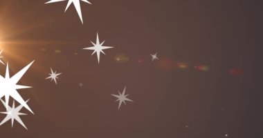 Yıldızların animasyonu ve kahverengi arkaplanda ışık. Noel, kış ve gelenek konsepti dijital olarak oluşturulmuş video.