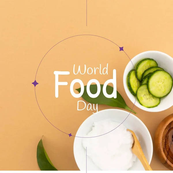 Image of world food day over bowls with cheese and cucumbers. Food, nutrition, agriculture, health and food production concept.