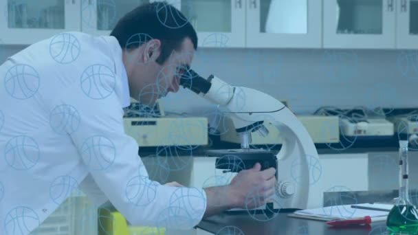 Multiple Basketball Icons Floating Caucasian Male Scientist Using Microscope Laboratory — Stock Video