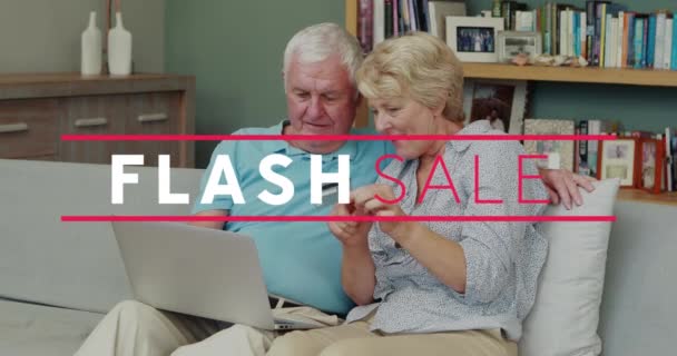 Animation Flash Sales Senior Caucasian Couple Sitting Sofa Using Laptop — Stock Video