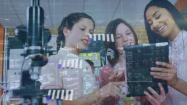 Animation of lights and data over diverse teenage pupils with tablet. School, education and learning with technology concept digitally generated video.