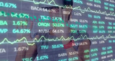 Animation of financial data over caucasian woman in vr headset. Finance, economy and technology concept digitally generated video.