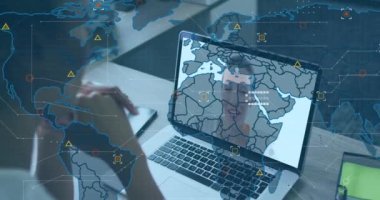 Animation of world map and icons over african american woman having video call on laptop. Business, finance, economy and technology concept digitally generated video.