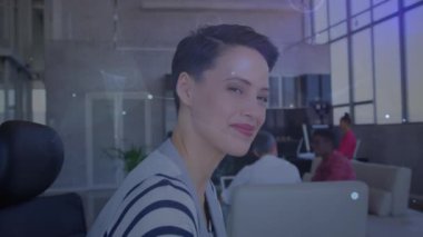 Animation of network of connections over happy caucasian woman looking at camera in office. Business, connections, cooperation and technology concept digitally generated video.