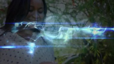 Abstract shape against caucasian family using laptop at home. Global business digital interface and technology concept digitally generated video.