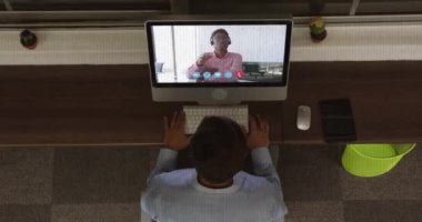 Animation of interference over african american businessman using laptop for video call. Global social media and digital interface concept digitally generated video.