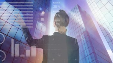 Animation of world map and graphs over back view of caucasian woman and skyscrapers. Business, finance and economy concept digitally generated video.