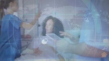 Animation of world map and viewfinder over diverse doctors and female patient. Health, medicine and technology concept digitally generated video.