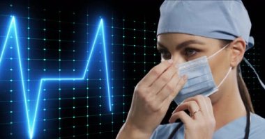 Animation of life line over female caucasian doctor on black background. Global medicine, technology, data processing and digital interface concept digitally generated video.