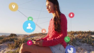 Animation of connections over happy caucasian woman with smartphone on beach. Network, connections, holidays and relax concept digitally generated video.