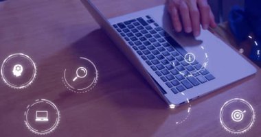Animation of falling education icons over person using laptop. Learning and education concept digitally generated video.