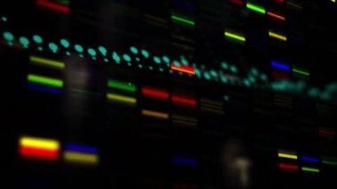 Digital animation of data processing over colorful mosaic squares against black background. Global networking and business technology concept